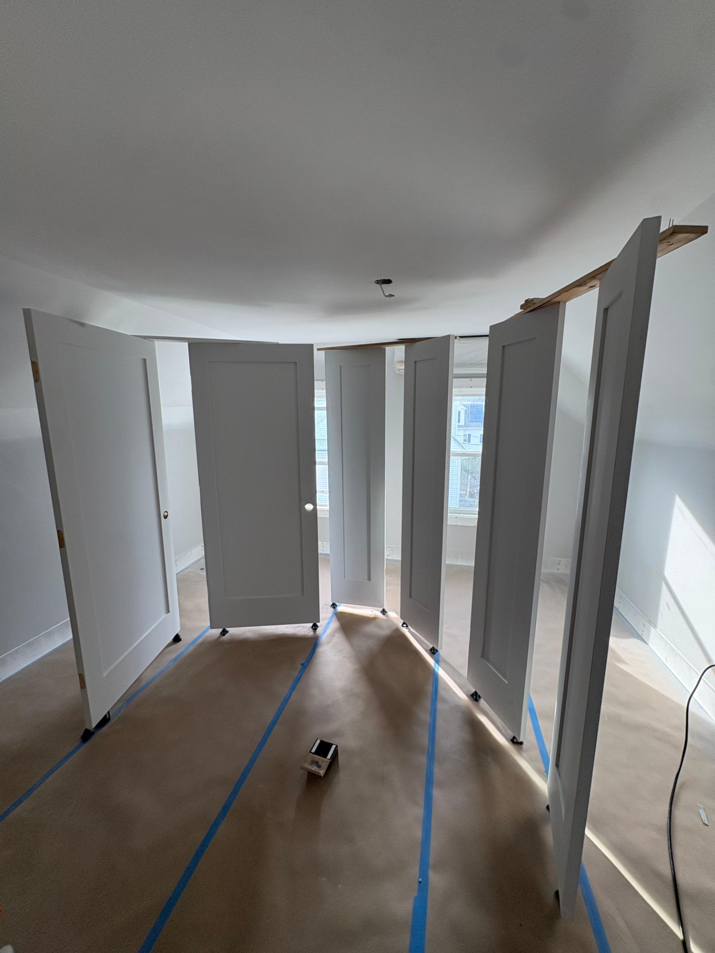 Interior doors set up and sprayed on site during a painting project