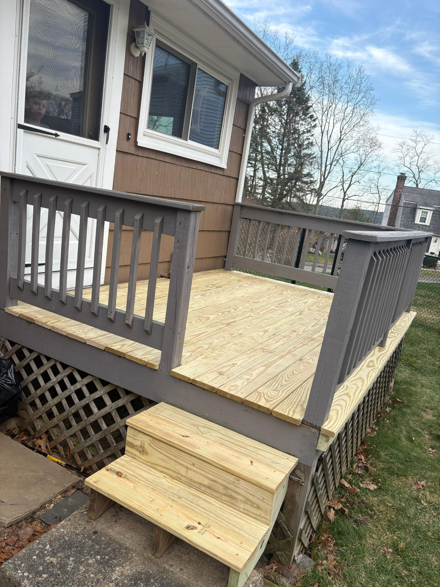Backyard deck with new untreated wood boards before staining and painting