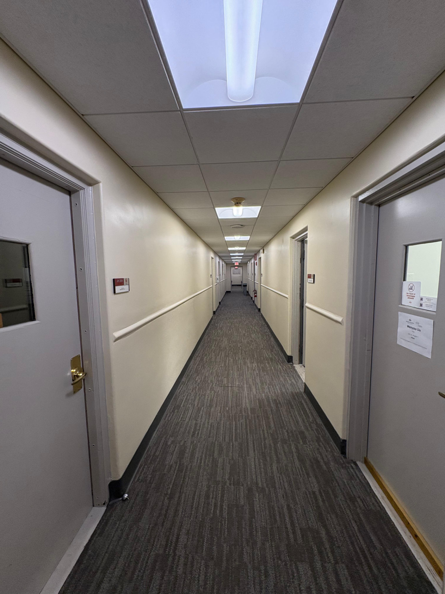Freshly painted commercial building corridor with clean walls and trim